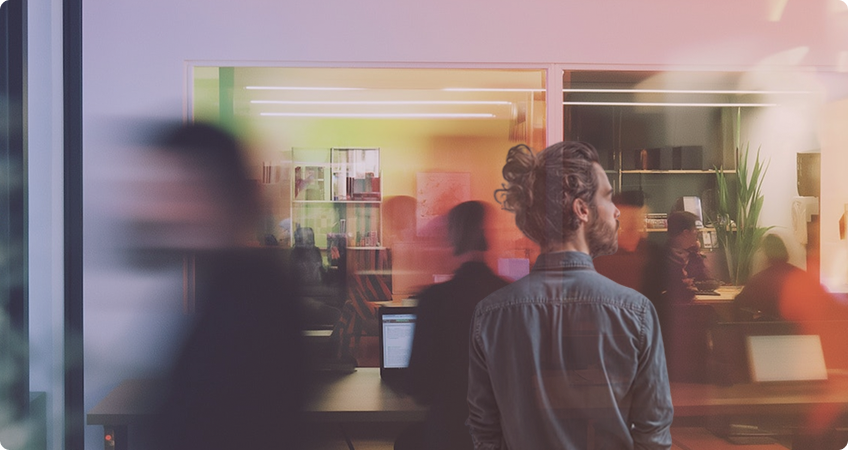 Man in office with blurred background