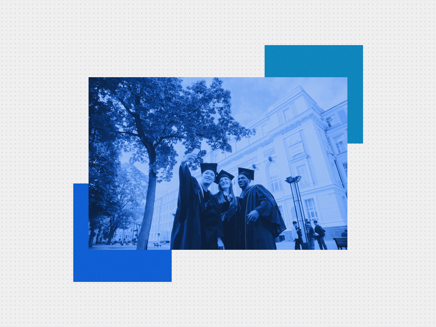 Three university graduates taking a selfie outside a campus building